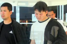 Chinese nationals charged with falsifying residency documents remanded to prison
